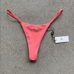 Super cute KL swim thong in Coral (S) Bathing suit